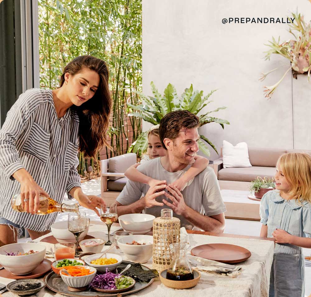 Dini Klein and her family enjoying a meal at the dining table