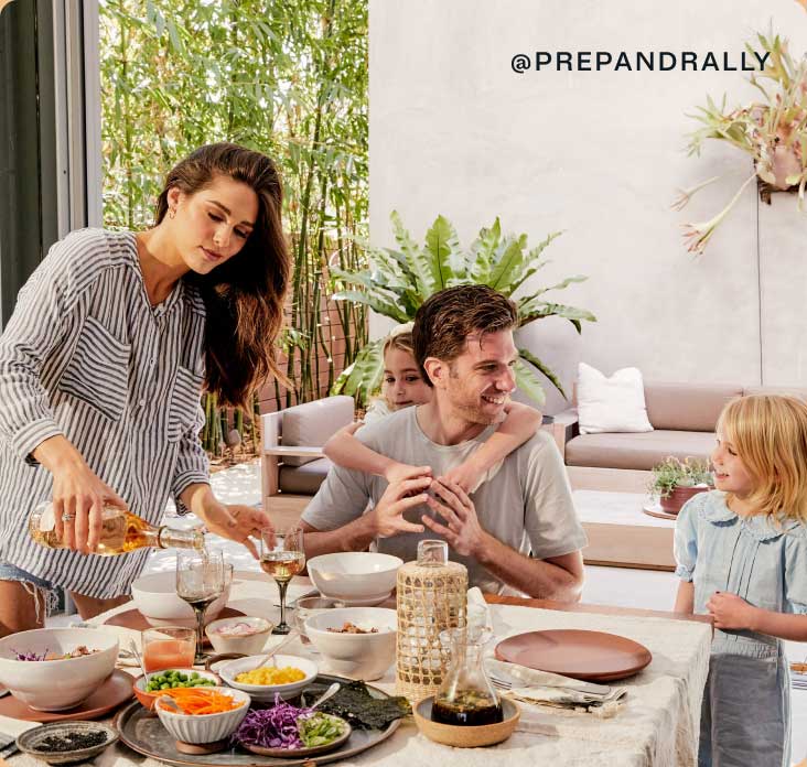 Dini Klein and her family enjoying a meal at the dining table