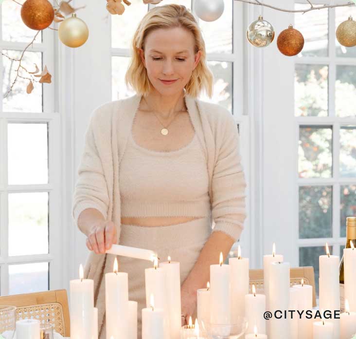 @citysage lighting candles at a holiday dinner party